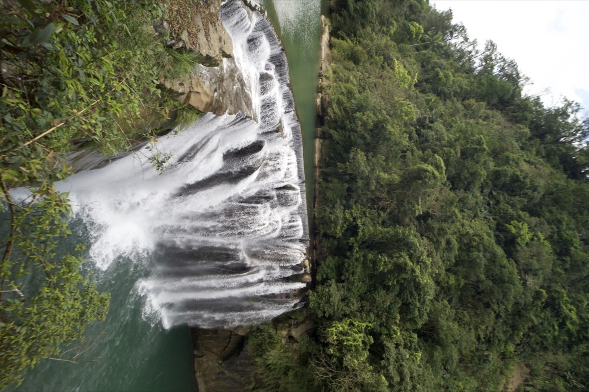 Shifen Waterfall with the water frozen into messy strands